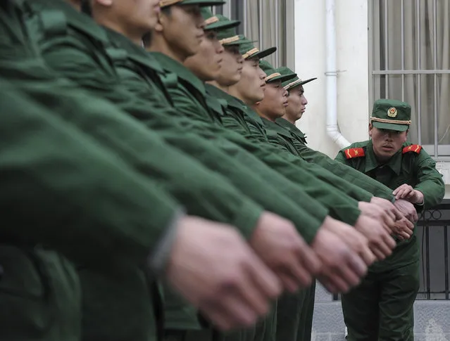 Chinese paramilitary police recruits attend a training session at a military base in Hefei, Anhui province. (Photo by Jianan Yu/Reuters)