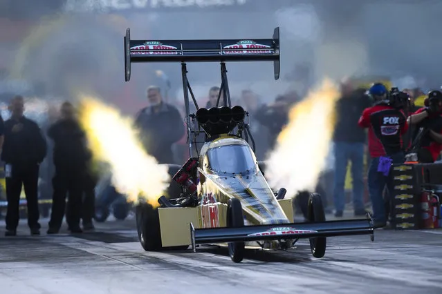 In this photo provided by the NHRA, Leah Pritchett drives during Top Fuel qualifying Friday, September 1, 2017, at the NHRA U.S. Nationals drag races at Lucas Oil Raceway Park near Brownsburg, Ind. Pritchett had a 3.667-pass at 329.50 mph to take the provisional lead in qualifying. (Photo by Jerry Foss/NHRA via AP Photo)