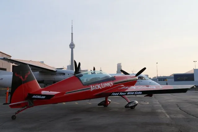 An Extra 300L aerobatic aircraft sits on display during media day for the Canadian International Air Show at Billy Bishop Airport, Toronto, Ontario, September 4, 2015. (Photo by Louis Nastro/Reuters)