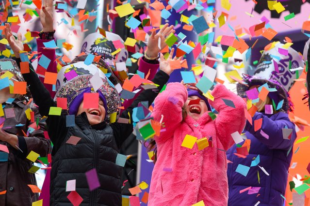 Kids cheer as they participate in the New Year's Eve Confetti Test in Times Square on December 29, 2024 in New York City. On New Year's Eve 3,000 pounds of confetti will be released over Times Square. (Photo by Alexi Rosenfeld/Getty Images)