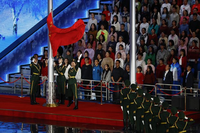 Members of the Chinese military raise a flag of China during the opening ceremony of the 9th Asian Winter Games in Harbin, China, Friday, February 7, 2025. (Photo by Issei Kato/Pool Photo via AP Photo)