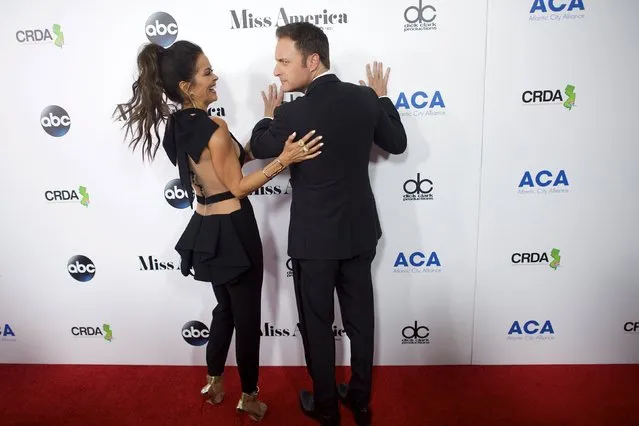 Hosts (L-R) Brooke Burke-Charvet and Chris Harrison arrive on the red carpet in Boardwalk Hall, the venue for the 95th Miss America Pageant, that takes place tonight in Atlantic City, New Jersey, September 13, 2015. (Photo by Mark Makela/Reuters)