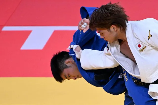 Japan's Hifumi Abe (white) and Japan's Joshiro Maruyama compete in their men's under 66 kg category gold medal bout during the 2022 World Judo Championships at the Humo Arena in Tashkent on October 7, 2022. (Photo by Kirill Kudryavtsev/AFP Photo)