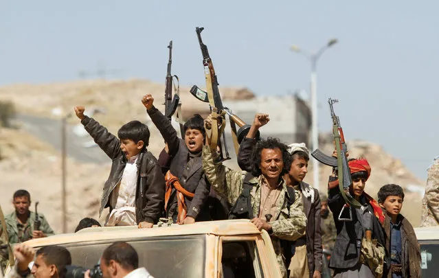 Newly recruited Houthi fighters ride in a truck before heading to the frontline to fight government forces in Sana’a, Yemen on November 15, 2017. (Photo by Mohamed al-Sayaghi/Reuters)