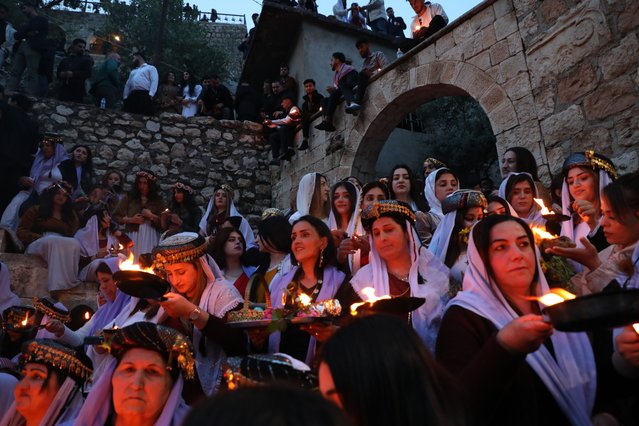 Members of the Yazidi community celebrate Charshama Sor (Red Wednesday) marking the New Year of the Yazidi, at the Lalish Temple in the Shekhan district of the Nineveh Governorate in the Kurdistan region of northern Iraq, 15 April 2025. The Lalish Temple is considered the main temple of the Yazidi religion and the New Year celebrations start on the eve of the day before Charshama Sor, which is on the third Wednesday of April. (Photo by Gailan Haji/EPA/EFE)