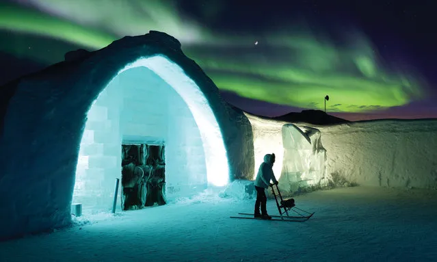 A view all guests will be hoping for: the northern lights glowing in the sky behind the Ice Hotel entrance. (Photo by Asaf Kliger/IceHotel/The Guardian)