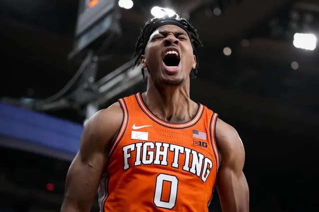 Illinois' Terrence Shannon Jr. (0) reacts after scoring and drawing a foul in overtime during the team's NCAA college basketball game against Texas in the Jimmy V Classic, Tuesday, December 6, 2022, in New York. (Photo by John Minchillo/AP Photo)