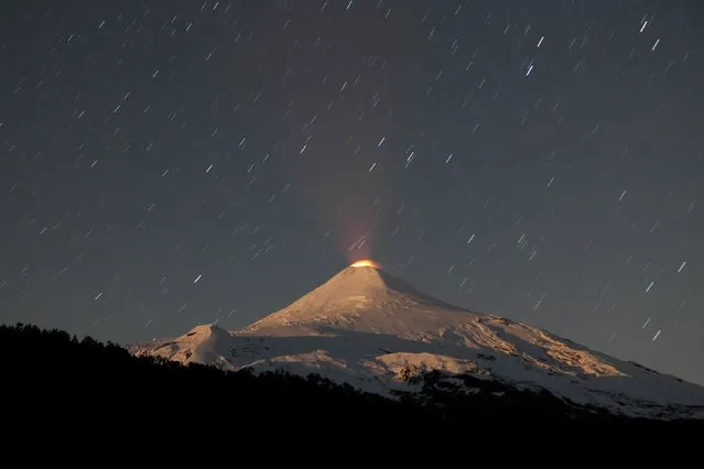 Villarrica volcano is seen at night in Chile, April 25, 2016. (Photo by Cristobal Saavedra/Reuters)