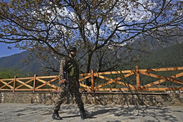 An Indian soldier patrols after an attack in Pahalgam, about 90kms (55 miles) from Srinagar on April 23, 2025. Indian security forces in Kashmir carried out a major manhunt on April 23, a day after gunmen opened fire on tourists killing 26 people in the region's deadliest attack on civilians since 2000. (Photo by Tauseef Mustafa/AFP Photo)