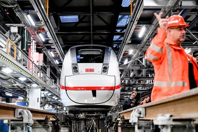 The Intercity-Express ICE  high-speed train is seen during opening of the extended hall in the ICE depot in Rummelsburg in Berlin, Germany, 20 December 2022.  After five years of construction the expansion of the Deutsche Bahn vehicle hall in the ICE plant in Berlin-Rummelsburg has been completed. (Photo by Filip Singer/EPA/EFE)