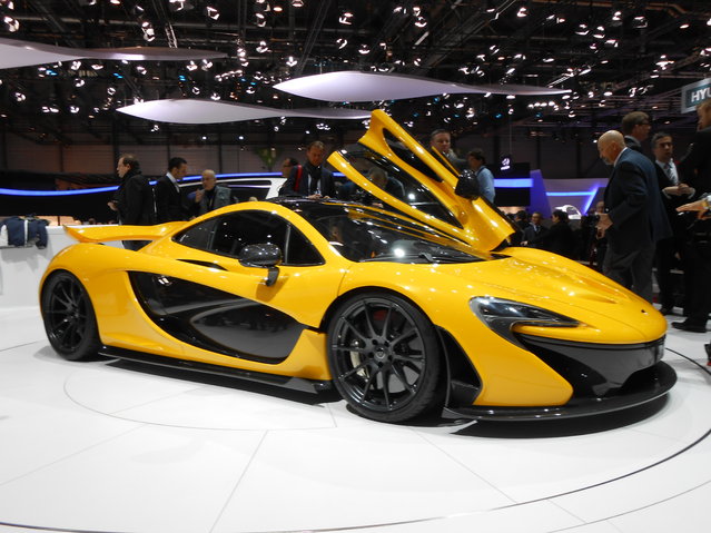 McLaren P1. P1 will cost $1.15 million. Production limited to 375 units. 727 horsepower from gas engine, 176 hp from electric. The production version of McLaren's P1 supercar has been revealed at the 2013 Geneva Auto Show. Finished in bright yellow, the road-ready P1 features a hybrid V8, gull wing doors and a host of high-performance features. (Photo by Luis Fernando Ramos/G1)