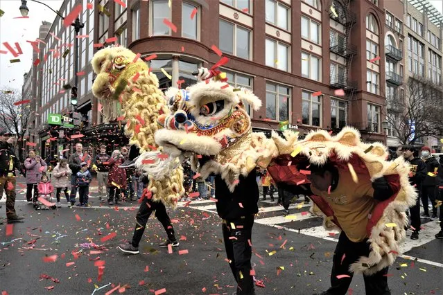 A dragon from the Chinese Youth Club Lion Dance Troupe performing before thousands of spectators on 7th Street during the DC Chinese Lunar New Year Parade Chinatown in Washington, DC on January 22, 2023. (Photo by Marvin Joseph/The Washington Post)