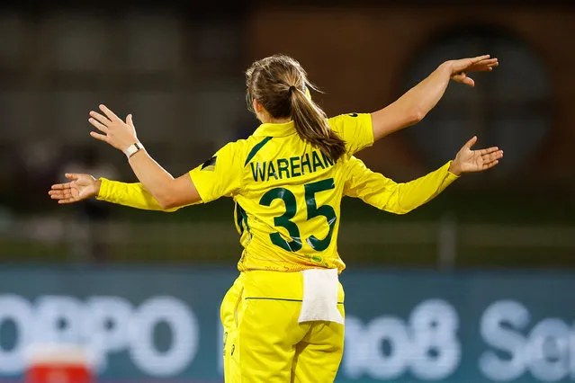 Australia's Georgia Wareham (C) celebrates after the dismissal of Bangladesh's Sobhana Mostary (not seen) during the Group A T20 women's World Cup cricket match between Australia and Bangladesh at St George's Park in Gqeberha on February 14, 2023. (Photo by Marco Longari/AFP Photo)
