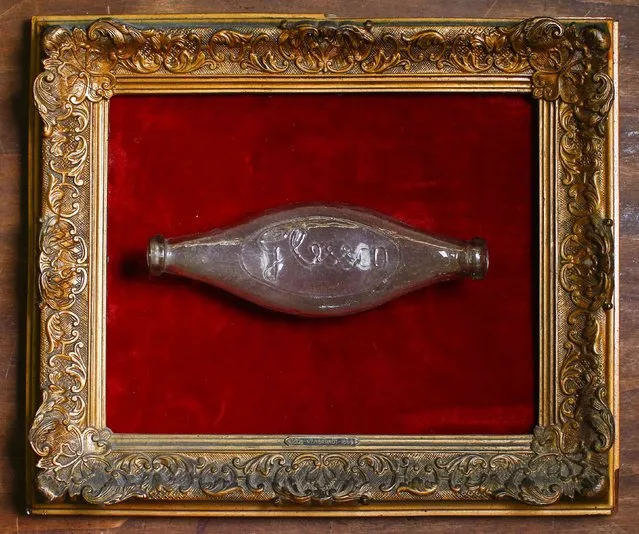 An antique baby feeding bottle is displayed in an old frame in the Museum of Domenico Agostinelli in Dragona, near Rome October 30, 2014. (Photo by Tony Gentile/Reuters)