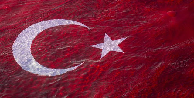 Students of the Akdeniz University Underwater Community open a 54-square meter Turkish flag and a 4-square meter Ataturk poster on the sea, during the 82nd anniversary of his demise, in Antalya, Turkey on November 10, 2020. As is customary, daily life stopped at 9.05 a.m. local time (0605GMT), sirens wailed to mark the exact moment of Ataturks death at the age of 57 and millions of people across the country observed two minutes of silence. (Photo by Mustafa Ciftci/Anadolu Agency via Getty Images)