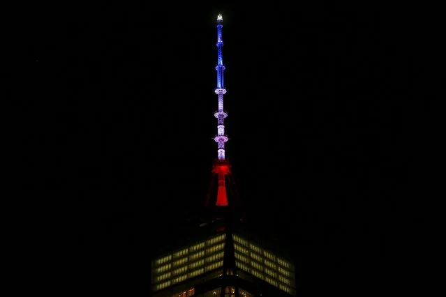One World Trade Center is lit in the Blue, White and Red colors of the French flag in honor of the victims of the attacks in Paris, in the Manhattan borough of New York November 13, 2015. (Photo by Carlo Allegri/Reuters)