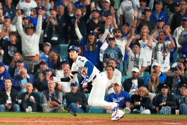 Los Angeles Dodgers' Shohei Ohtani watches his RBI-Double against the Toronto Blue Jays during the fifth inning in Game 3 of baseball's World Series, Monday, October 27, 2025, in Los Angeles. (Photo by Mark J. Terrill/AP Photo)