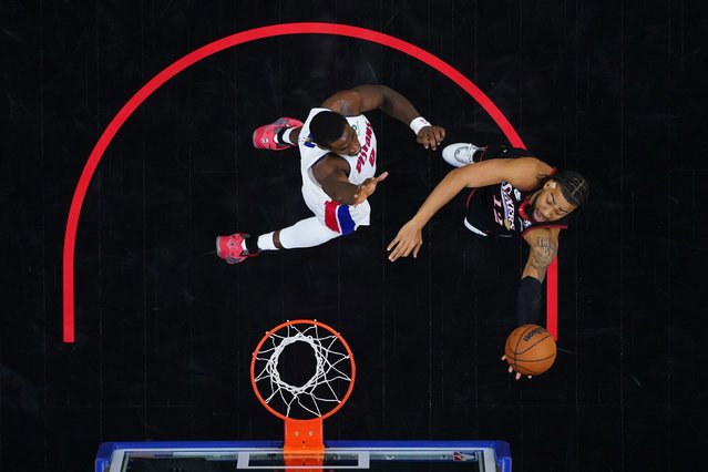The Philadelphia 76ers' Trendon Watford, right, goes up for a shot against the Detroit Pistons' Jalen Duren during an NBA game in Philadelphia on Sunday, November 9, 2025. (Photo by Matt Slocum/AP Photo)