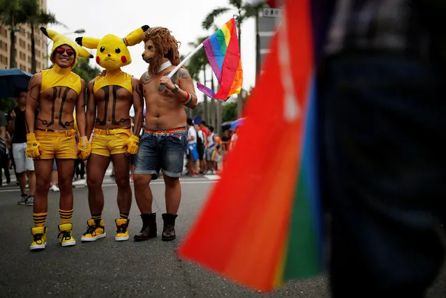 Participants wearing hats of a Pokemon character, Pikachu, take part in the lesbian, gay, bisexual and transgender (LGBT) pride parade in Taipei, Taiwan October 29, 2016. (Photo by Tyrone Siu/Reuters)
