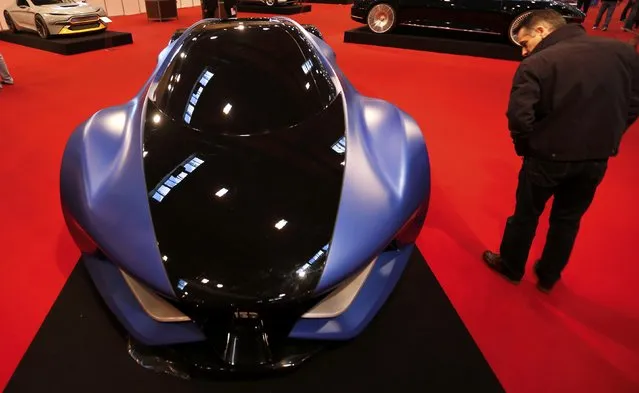 A visitor looks at the concept car "IED Syrma Concept" at the Essen Motor Show in Essen, Germany, November 27, 2015. (Photo by Ina Fassbender/Reuters)