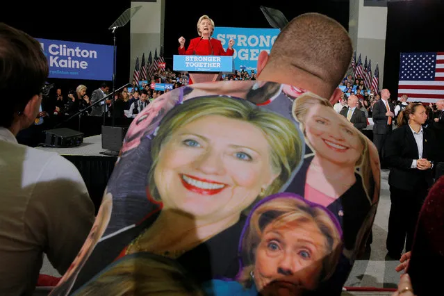 A man wearing a t-shirt with portraits of U.S. Democratic presidential nominee Hillary Clinton listens as she speaks at a campaign rally at Kent State University in Kent, Ohio, U.S. October 31, 2016. (Photo by Brian Snyder/Reuters)