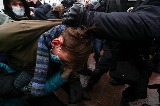A law enforcement officer detains a participant during a rally in support of jailed Russian opposition leader Alexei Navalny in Moscow, Russia on January 23, 2021. (Photo by Evgenia Novozhenina/Reuters)
