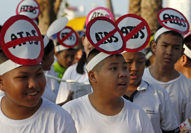 Thai activists march through Pattaya resort town to raise awareness on the World Aids Day in Pattaya, east of Bangkok, Thailand December 1, 2015. (Photo by Chaiwat Subprasom/Reuters)