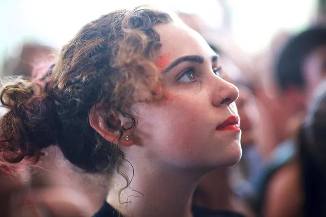 Michaela Keegan, 18, watches The Regrettes perform on the second day of the Firefly Music Festival in Dover, Delaware June 15, 2018. (Photo by Mark Makela/Reuters)