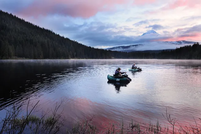 “Fishing at sunrise”. Early morning at Trillium lake, Oregon, the sun had not fully come out yet, but these two folks had already launched their boats for fishing. It was quite a lot of fun to watch them chatting and casting the line, especially with the morning colors and mist. (Photo and caption by Victor Liu/National Geographic Traveler Photo Contest)