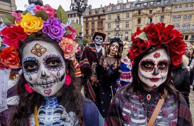 People take part in the traditional Catrina parade marking the Day of the Dead in front of the Old Opera in Frankfurt, Germany, Saturday, November 2, 2024. (Photo by Michael Probst/AP Photo)