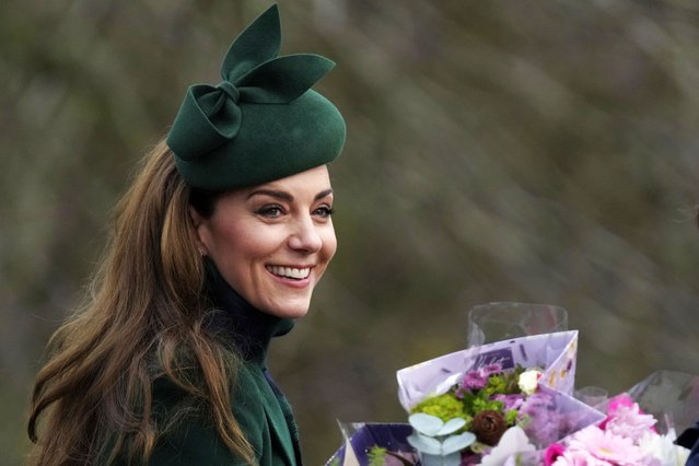 Kate Princess of Wales smiles as holds a bouquet of flowers gives to her by well-wishers after she attended the Christmas day service at St Mary Magdalene Church in Sandringham in Norfolk, England, Wednesday, December 25, 2024. (Photo by Jon Super/AP Photo)