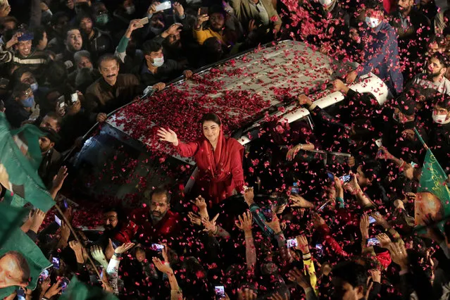 Supporters of opposition political party Pakistani Muslim League (Nawaz) surround the convoy of their leader Maryam Nawaz Sharif during an anti-government rally, in Lahore, Pakistan, 10 December 2020. The major opposition political parties, that have formed an alliance Pakistan Democratic Movement (PDM) are gearing up for an anti-government rally in Lahore 13 December. (Photo by Rahat Dar/EPA/EFE)