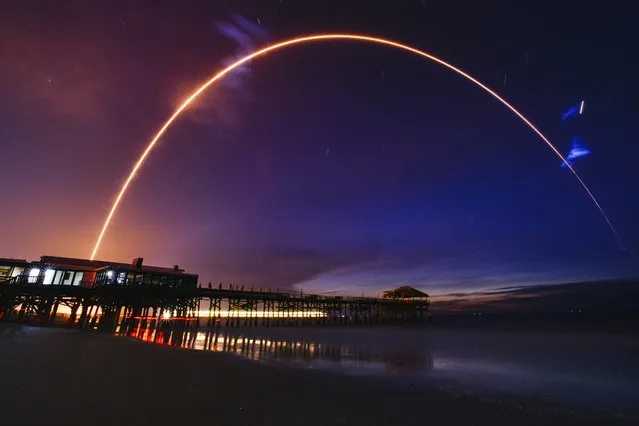 A Delta IV Heavy rocket caught by a camera with long exposure in Cocoa Beach, Florida during its launch from Cape Canaveral Space Force Station on June 22, 2023. (Photo by Malcolm Denemark/AP Photo)