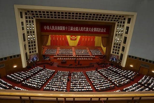Delegates attend the opening session of China's National People's Congress (NPC) at the Great Hall of the People in Beijing, Friday, March 5, 2021. (Photo by Andy Wong/AP Photo)