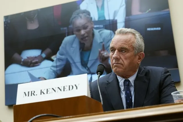 Democratic presidential candidate Robert F. Kennedy Jr., listens as Maya Wiley, president and CEO of the Leadership Conference on Civil and Human Rights, is seen on a screen while she testifies before a House Judiciary Select Subcommittee on the Weaponization of the Federal Government hearing on Capitol Hill in Washington, Thursday, July 20, 2023. (Photo by Patrick Semansky/AP Photo)