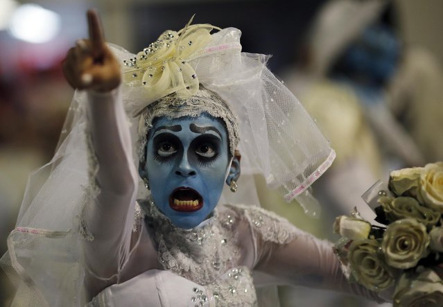 A reveller from Tom Maior Samba School takes part in a carnival at Anhembi Sambadrome in Sao Paulo February 14, 2015. (Photo by Nacho Doce/Reuters)