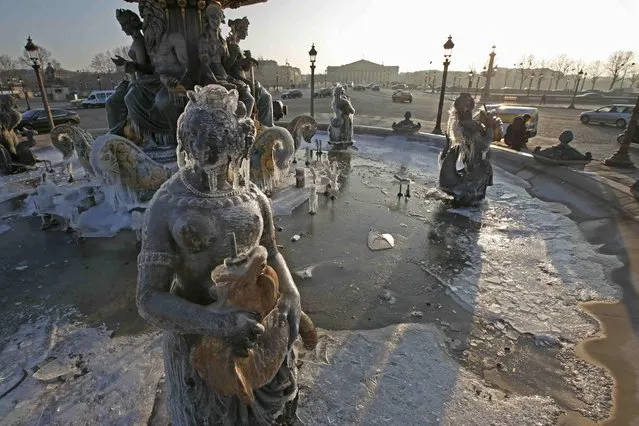 Icicles hang on a statue at the Fountain of the Place de la Concorde on a cold winter day in Paris, France, January 20, 2016. (Photo by Philippe Wojazer/Reuters)