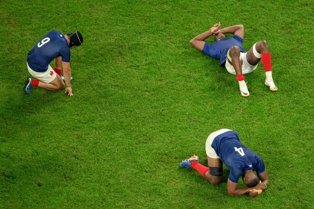 France's scrum-half and captain Antoine Dupont (L), France's lock Cameron Woki (R) and France's flanker Sekou Macalou (TOP) react after defeat in the France 2023 Rugby World Cup quarter-final match between France and South Africa at the Stade de France in Saint-Denis, on the outskirts of Paris, on October 15, 2023. (Photo by Antonin Thuillier/AFP Photo)