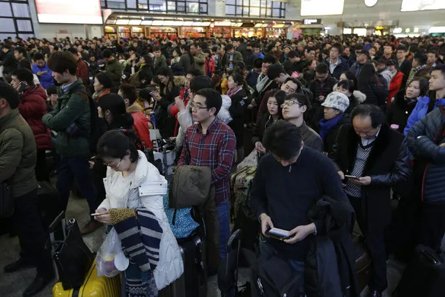 Passengers wait to board a train to Xi'an, at the Beijing West Railway Station, in Beijing, China, February 1, 2016. (Photo by Jason Lee/Reuters)