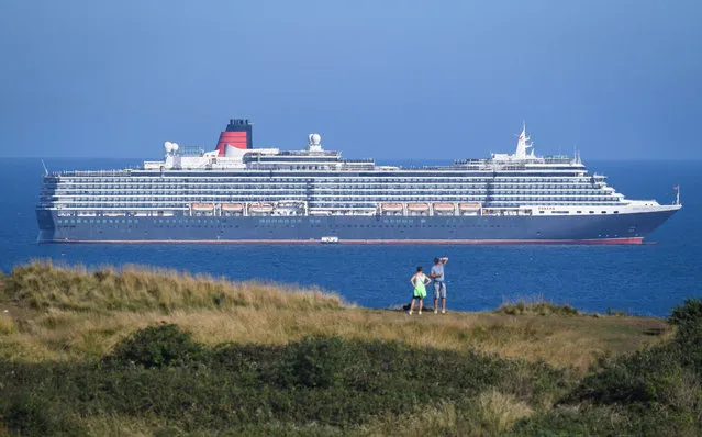 Cruise ship Queen Victoria anchored in the English Channel off the Dorset coast as the industry remains at a standstill due to the coronavirus pandemic on August 18, 2020 in Weymouth, England. (Photo by Finnbarr Webster/Getty Images)