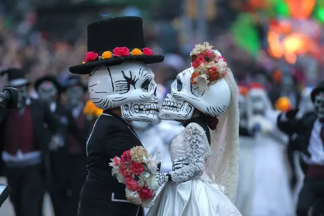 Artists perform in the Day of the Dead Parade in Downtown Mexico City, Capital of Mexico, on October 29, 2022. (Photo by Xinhua News Agency/Rex Features/Shutterstock)