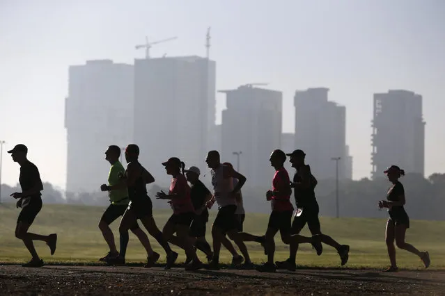 Runners warm up before a marathon in Tel Aviv, Israel February 26, 2016. (Photo by Amir Cohen/Reuters)