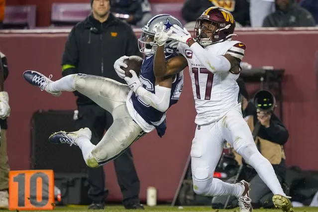 Dallas Cowboys cornerback DaRon Bland (26) making an interception catch against Washington Commanders wide receiver Terry McLaurin (17) during the second half of an NFL football game, Sunday, January 7, 2024, in Landover, Md. (Photo by Susan Walsh/AP Photo)