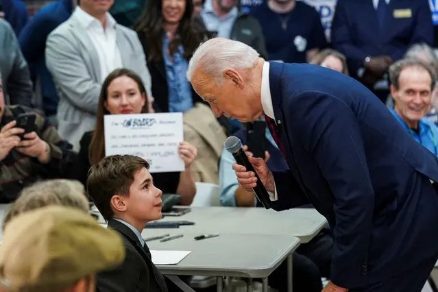 U.S. President Joe Biden greets 9-year-old Harry Abramson, who has a severe stutter, and wrote a letter to President Biden, who also stutters, about how the president has given him more confidence, at the campaign headquarters for the state of Wisconsin, in Milwaukee, Wisconsin, U.S., March 13, 2024. (Photo by Kevin Lamarque/Reuters)
