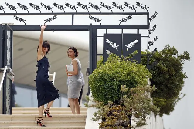 Jury member actress Sophie Marceau (L) waves as she arrives to attend a photocall before the opening of the 68th Cannes Film Festival in Cannes, southern France, May 13, 2015. (Photo by Benoit Tessier/Reuters)