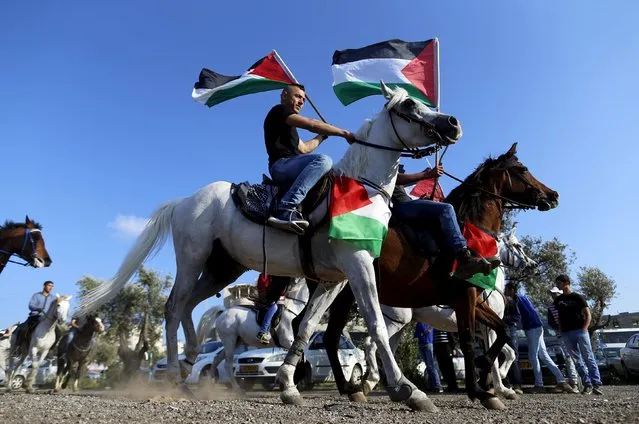Israeli Arab demonstrators ride horses during a Land Day rally in the northern Israeli village of Arrabe March 30, 2016. Land Day commemorates the killing of six Arab citizens of Israel by security forces during protests in 1976 over government land confiscations. (Photo by Ammar Awad/Reuters)