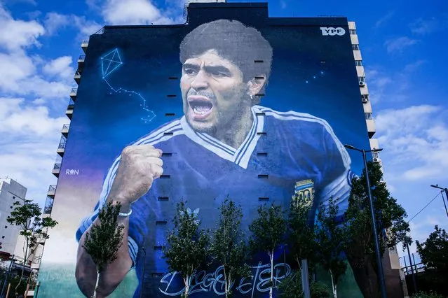 A view of a giant Diego Maradona mural created by artist Martin Ron from his series of murals called the “Capitanes” in Buenos Aires, Argentina, on December 14, 2023. Martin Ron has created both Diego Maradona and Leonel Messi's murals to pay tribute for the two great footballers who led Argentina to victory on 1986 and 2022 FIFA World Cup. (Photo by Luciano Gonzalez/Anadolu via Getty Images)