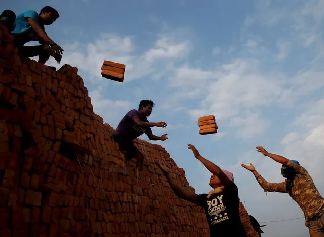 Men work at a brick factory in Bhaktapur, Nepal, May 17, 2015. (Photo by Ahmad Masood/Reuters)