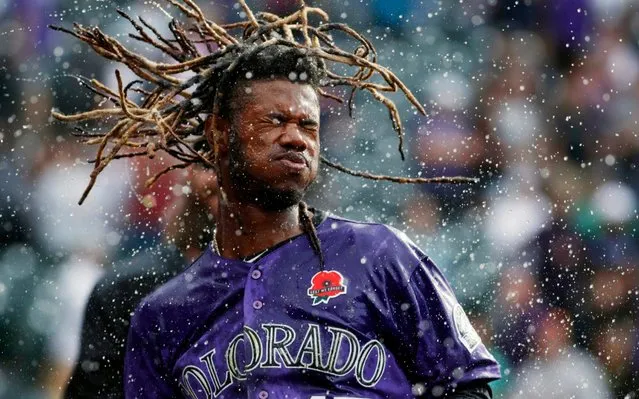 Colorado Rockies' Raimel Tapia shakes his head after being doused in celebration of his walk-off single off Arizona Diamondbacks relief pitcher Matt Andriese in the 11th inning of a baseball game, Monday, May 27, 2019, in Denver. The Rockies won 4-3. (Photo by David Zalubowski/AP Photo)