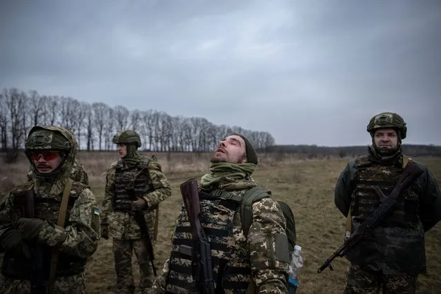 New recruits of the 1st Da Vinci Wolves Separate Mechanized Battalion, named after Dmytro Kotsiubailo, rest during a military exercise in an undisclosed location, in Central Ukraine on March 12, 2024. (Photo by Viacheslav Ratynskyi/Reuters)